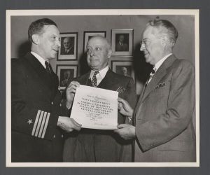 School of Dentistry, 1940s - Captain Robert Strite of the United States Navy presenting a commendation to the School of Dentistry for working with the Navy on the V-12 Navy College Training Program