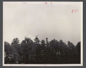 Aerial campus photographs - Helicopter flying near water tower