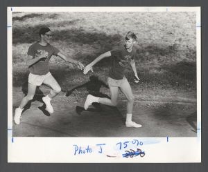 Students, groups, 1960s - Students running a relay on the track