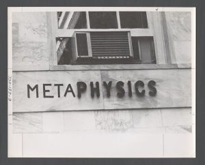 Students, groups, 1970s - "Meta" painted next to the sign for the Physics building to form the word "Metaphysics"