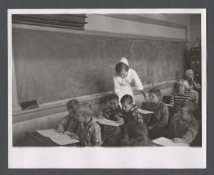 Department of Physical Medicine, 1940s-1950s - Nurse in classroom with children