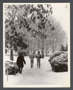 Unusual weather on campus - People walking on snowy sidewalk