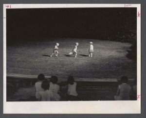 Faculty Camp - Three children play in the amphitheater