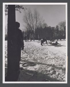 Unusual weather on campus - Student slides down hill on belly