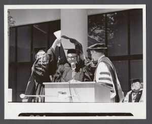 Commencement, 1970s - Unidentified figure being hooded