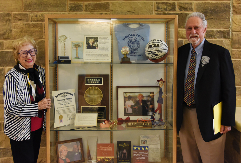 Betty L. Siegel and Joel Siegel with Siegel Exhibition display, November 13, 2017