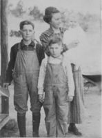 Marietta Jones Cox with Norman Cox, Homer Cox, and baby Leona Cox