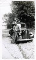 Lemon Smith standing by the first city of Acworth utilities truck