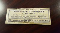 "Tabloid Adhesive Compress"