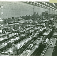 Men and women working on factory floor