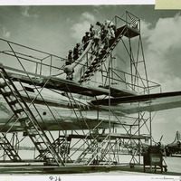 Employees finishing plane tail