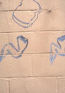 Blue graffiti on white wall