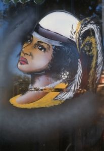 Woman in hat with feathers