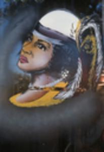 Woman in white hat with feathers