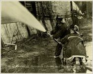 Two Firemen Using Fire Hose