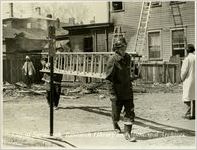 Firemen Carrying Ladder