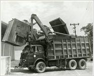 Garbage Truck Lifting Dumpster