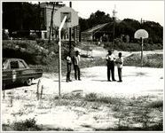Policeman with Youth at Basketball Court