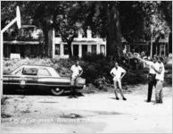 Policeman Instructing Youth Playing Basketball