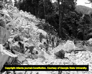 Prisoners working in rock quarry. Unidentified photograph that may be of Keith Quarry near Palmetto, Fulton County, Georgia, ca. 1948.