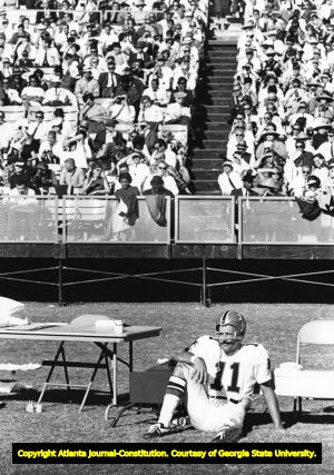Atlanta Falcons' quarterback Randy Johnson takes a break during a game, circa 1960s