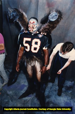 Atlanta Falcons' Jessie Tuggle dresses up as a tarantula football player, 1994