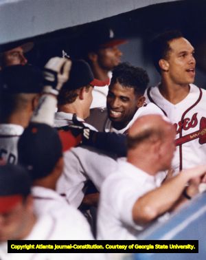 Atlanta Braves team members congratulate Deion Sanders after hitting a homerun, 1992