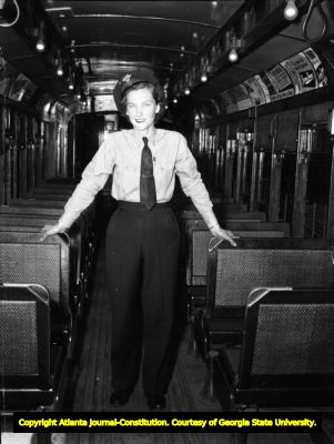 Interior view of a trolley car operated by a woman, circa 1940s