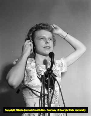 Portrait of a telephone operator with a headset and mouthpiece, circa 1940s