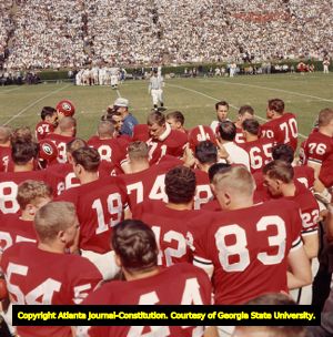 Georgia Bulldogs' players gather on the sidelines before a game, 1965