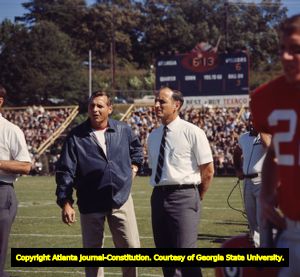 Coach Vince Dooley and assistant Bill Dooley during a game, 1965