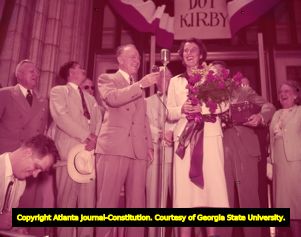 Atlanta mayor Hartsfield welcomes Dorothy Kirby after winning the golf tournament, 1951