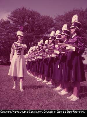 Drum major Mary Ellen Bridges Jackson leading the Monroe Girls Bugle Corps during practice, 1955