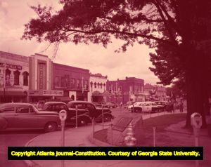 Movie theaters and stores along downtown Newnan's business district, 1950