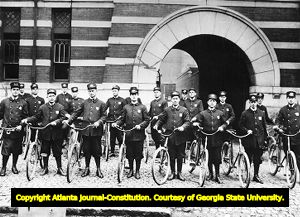 Atlanta police officers with their bicycle patrolman, circa 1910s