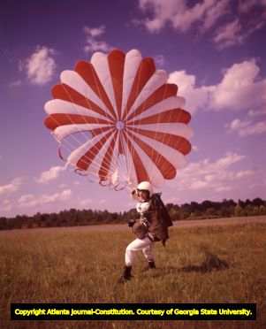 Skydiver Patricia Hollins lands safely on the ground after deploying her chute, 1965