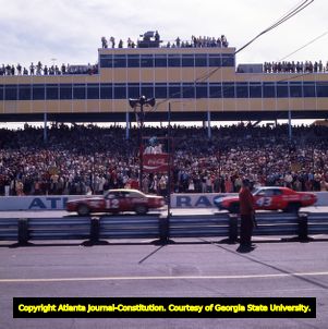 Cars race through the finish line at the Atlanta Motor Speedway, 1972