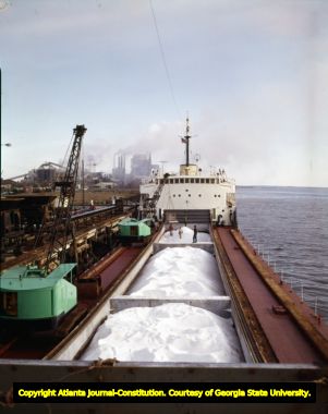 Large transport ship preparing to unload its cargo of salt, 1966