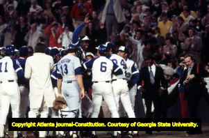 Hank Aaron being congratulated at home plate after breaking the home run record, 1974