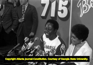 Hank Aaron fielding questions at a press conference after breaking Babe Ruth's homerun record, 1974
