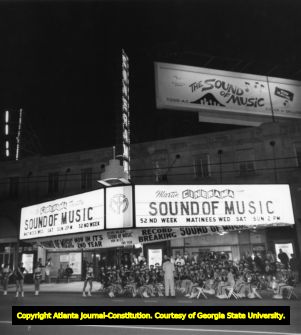 Martin Cinerama premiering "The Sound of Music" with a live marching band, 1966