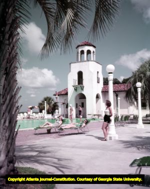 Vacationers lounge by the pool at a Savannah beachfront hotel, 1954
