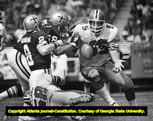 Atlanta Falcon Don Smith chasing New Orleans Saint Archie Manning, 1981