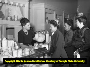 Shoppers line up at the cosmetics counter in a department store, 1945