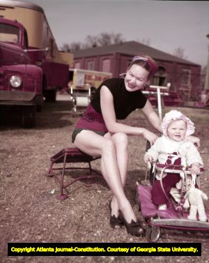 King Bros. and Cristiani circus performer with her child, 1950