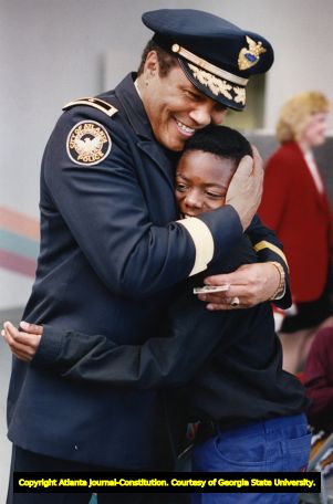 Atlanta Police Chief Eldrin Bell donates prize money to children's home, 1993