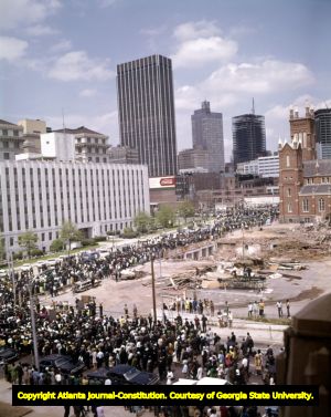 Crowds walk through downtown Atlanta in the Martin Luther King Jr. funeral procession, 1968