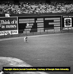 Atlanta Braves outfielder Hank Aaron next to his homerun tally, 1973