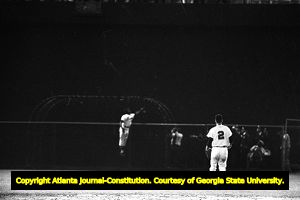 Right fielder Hank Aaron tries to catch a home run ball, 1966
