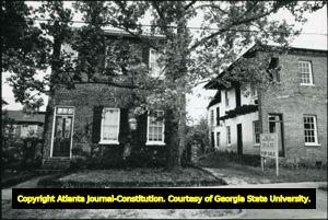 Two brick 19th-century townhouses in Mobile, Alabama, April 22, 1988.
